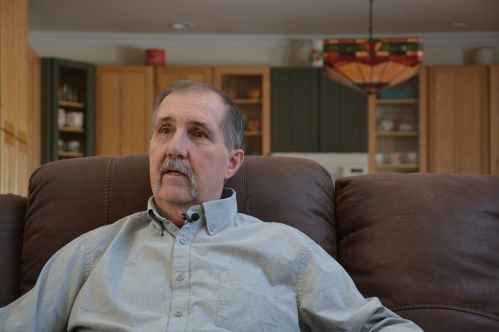Terry Stauffer in his living room at his Calhan home.