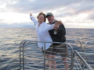 In this photo, Connie Kassel and Bob Bryant reenact the iconic "I'm Flying!" scene from the movie Titanic while on a boat in Hawaii.