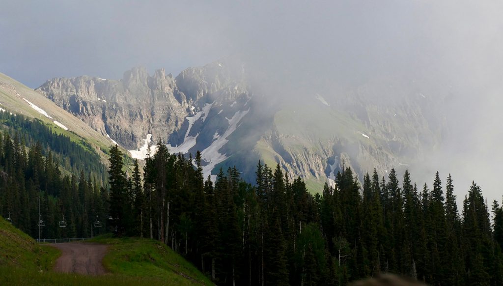 view of mountains through a misty cloud on a free gondola in Telluride, Colorado