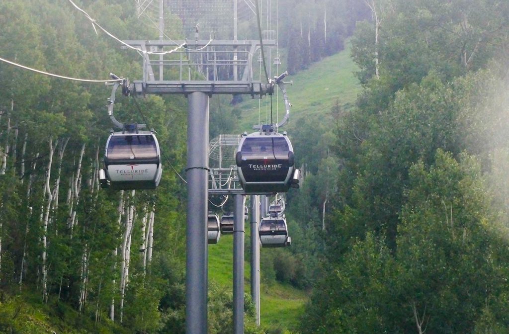 a view of gondola cabins at Telluride on a summer day. Telluride has one of Colorados free gondolas.