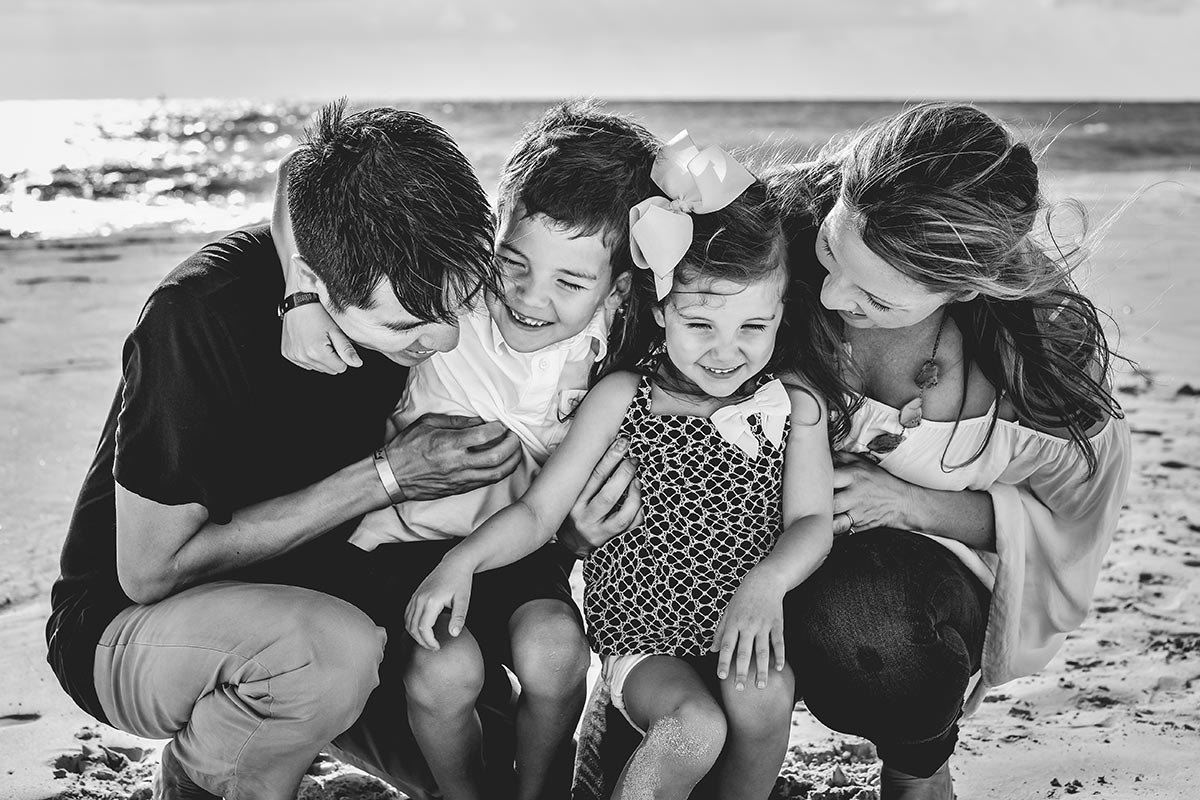 Parents with two kids at the beach, after David Procedure helped dad's heart.