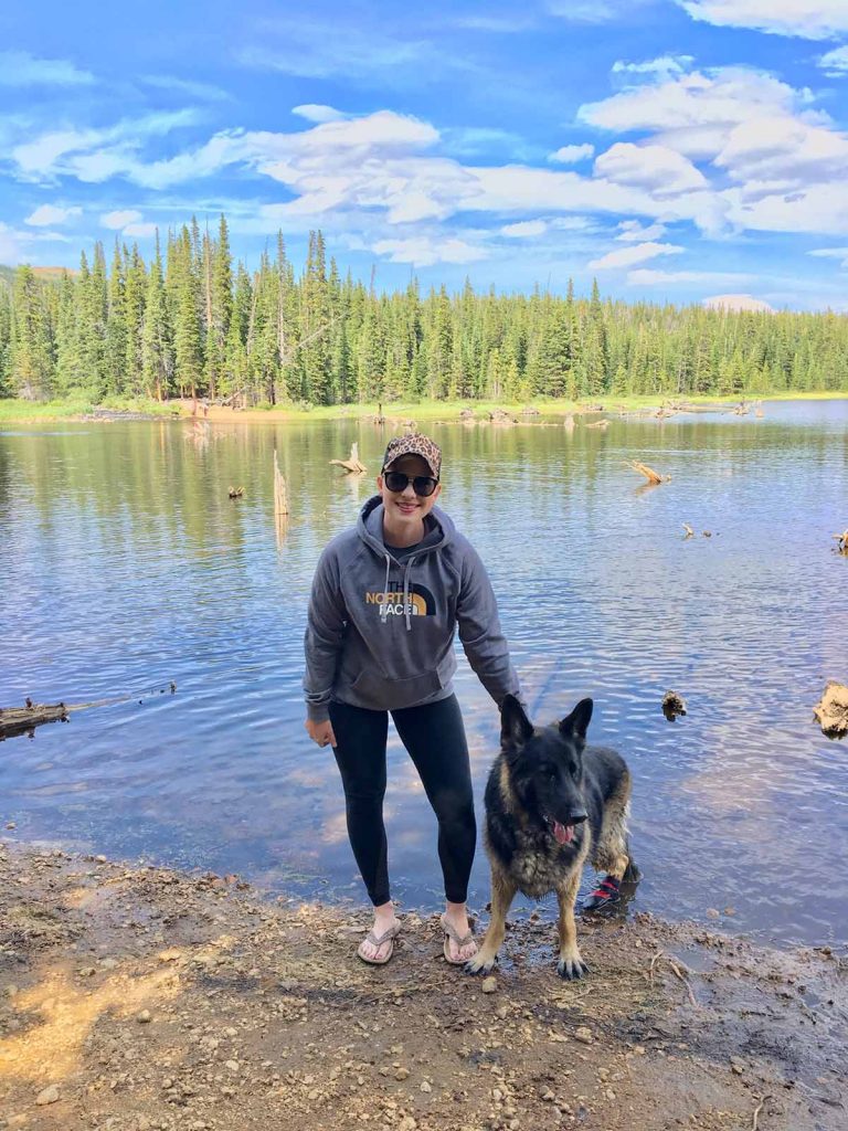 Lauren enjoying a Colorado lake with her dog.