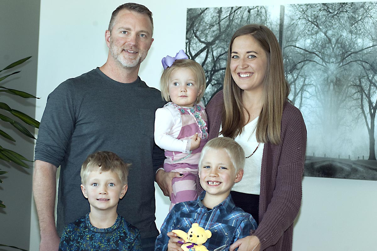 Beaudin's family stands for a photo after he had his blood drawn at the hospital.