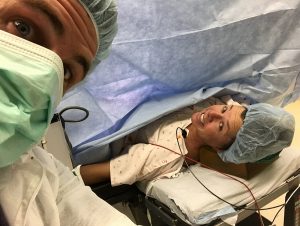 Graham and Erin McDaniel take a selfie in the operating room at UCHealth Yampa Valley Medical Center before the delivery of their second child.