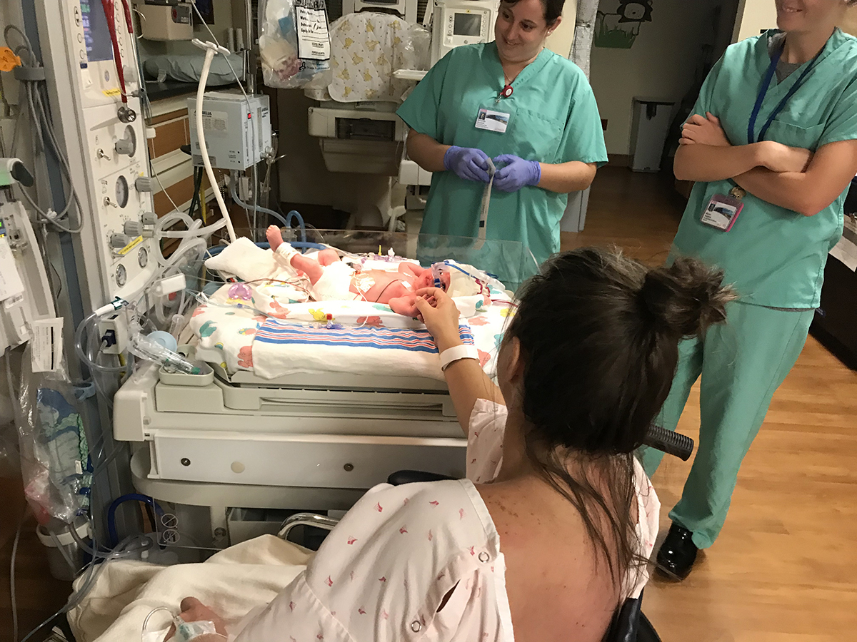In this photo, Erin McDaniel meets her daughter, Mimi, in the special care nursery at UCHealth Birth Center in Steamboat Springs.