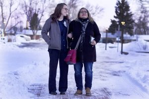 Nurse and patient's sister stand outside of hospital where patient didn't want to die in the ICU