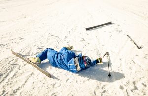 This photo shows a person who has fallen down on on a ski slope