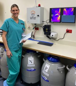 A new system called Cryo Sentinel protects frozen embryos at UCHealth University of Colorado Hospital. Here Dr. Liesl Nel-Themat, who manages the lab, stands with tanks that hold frozen embryos and a new system which uses thermal imaging to monitor the temperatures of the tanks.