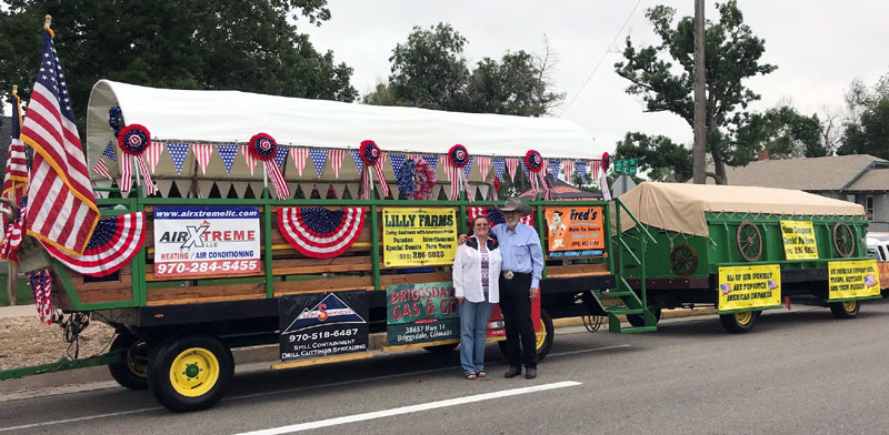 Jack, a heart disease patient, and his wife, Tina, stand in front of their patriotic parade float.