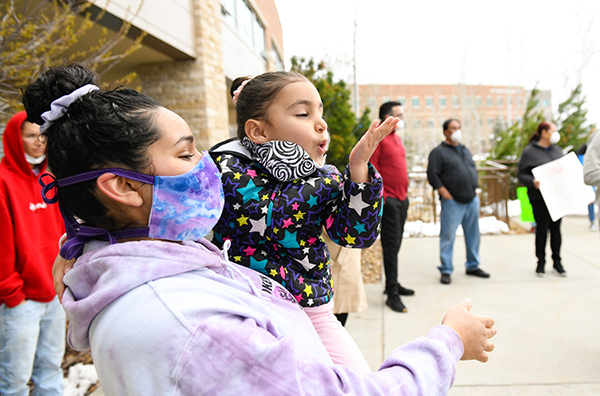 JBS worker, Sergio Rodriguez, was greeted by one of his great granddaughters as he left UCHealth Medical Center of the Rockies on Saturday.