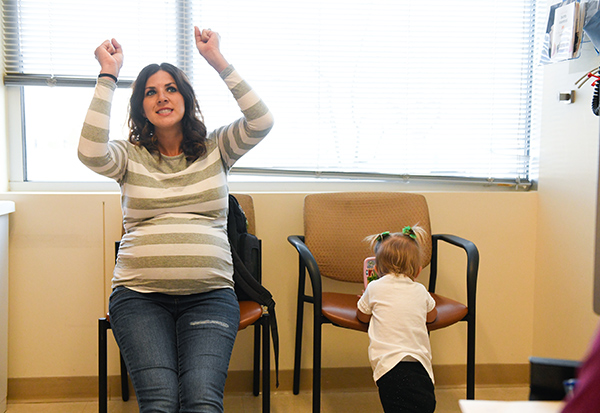 Amanda Kronebusch cheers during a prenatal visit. Everything was going well, then she had to give birth during a pandemic.