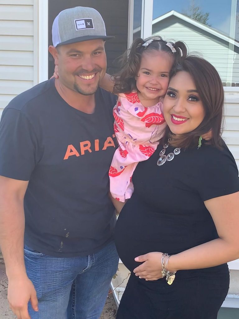 Remote patient monitoring for COVID-19 patients. Sergio and Erika Ibuado are photographed with their daughter Scarlett. Erika learned she had COVID-19 while pregnant. She was able to stay safe at home thanks to remote patient monitoring for patients with COVID-19.