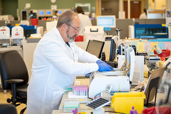 High-quality antibody tests are now available to the public in Colorado at various locations throughout Colorado. Here, a lab manager works on tests at a UCHealth lab.