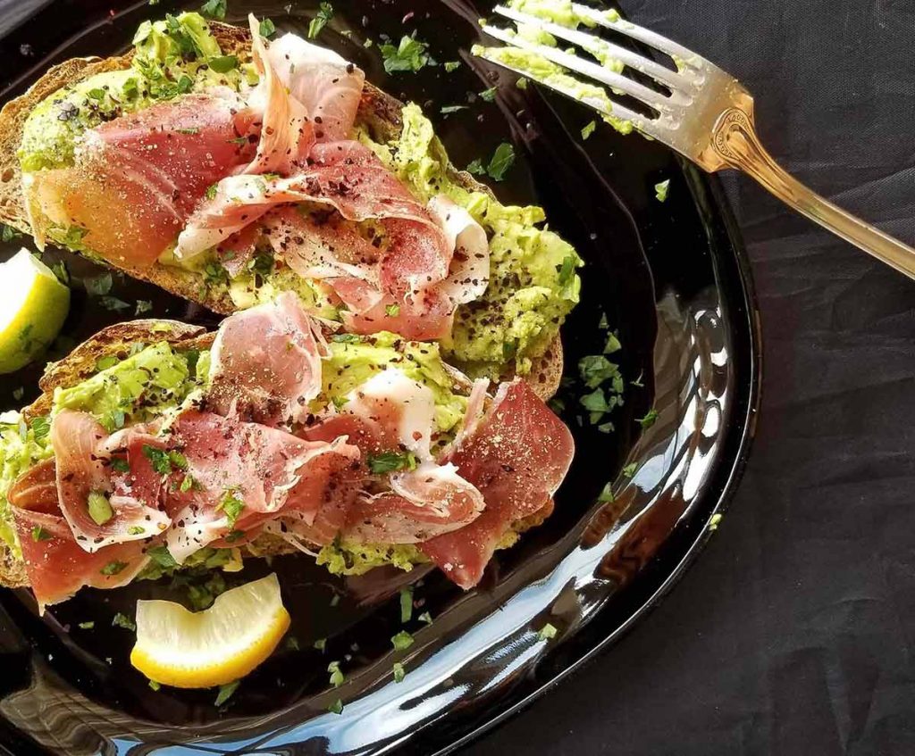 Avocado toast with Italian prosciutto