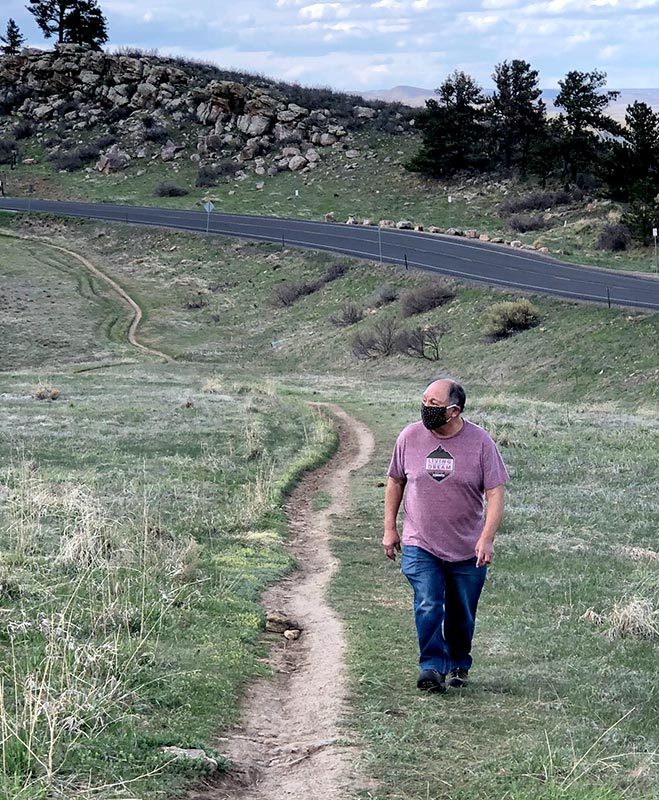 Sam walking along a trail at Horsetooth reservoir after going to the ER for chest pains and undergoing a quadruple bypass.