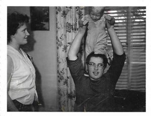 baby on his uncles shoulders, both among the family's four generations born at the same hospital.