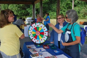 A Master Food Educator talks with a member of the public