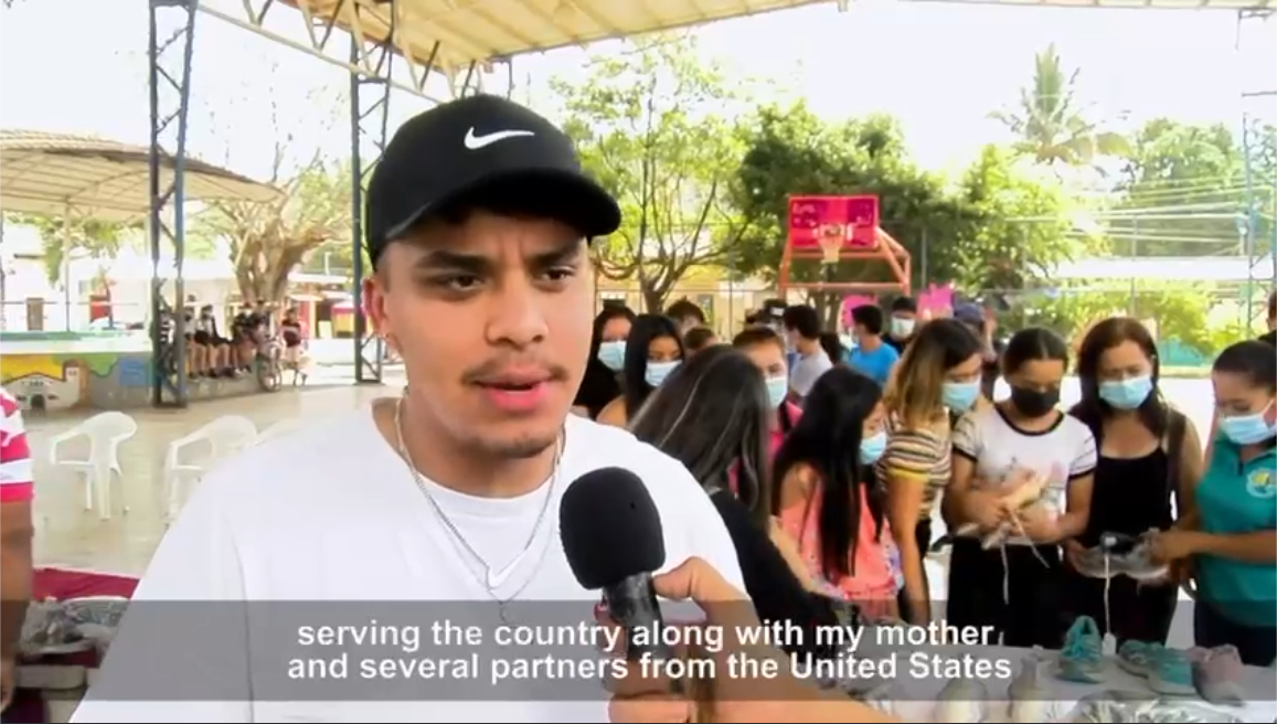 Angel Serrano helping San Julian's children through a sneakers donation provided by Nike Boston