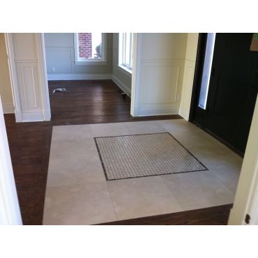 Installed hardwood, custom trim and tile