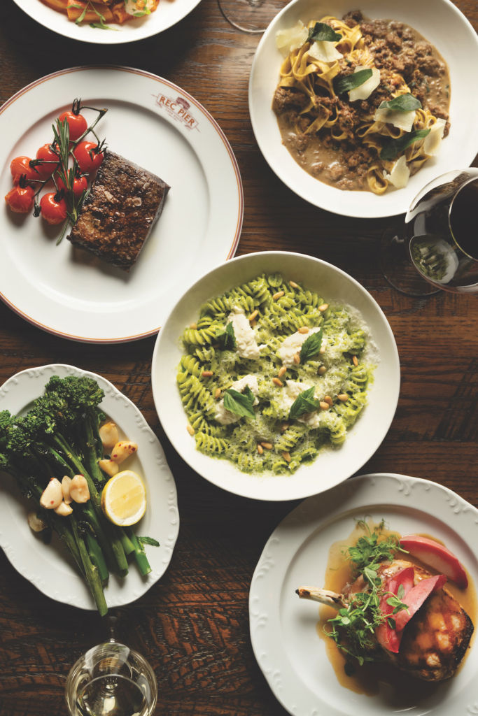 a table set with many different elegant dishes