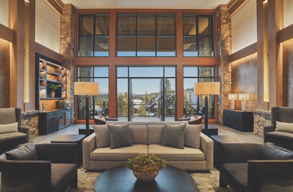 seating area with gray and black furniture and large windows