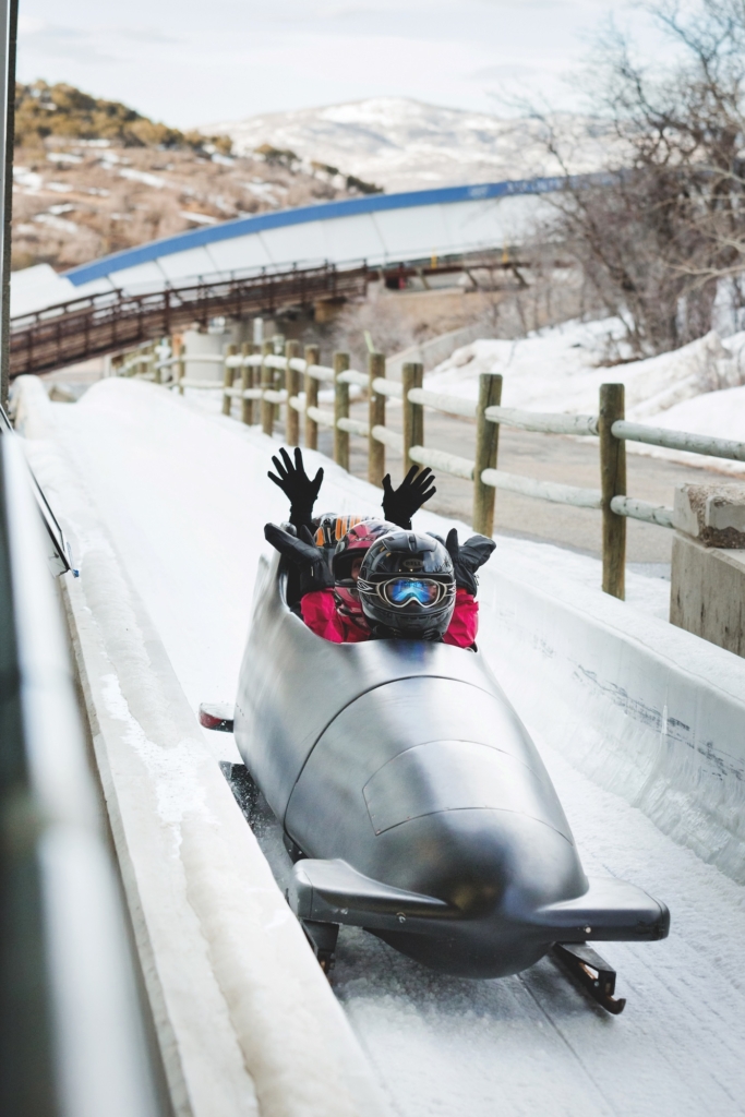 People bobsledding