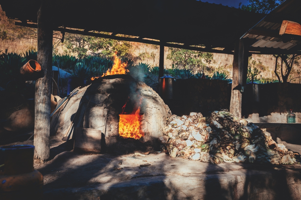 Distilling spirits by fire