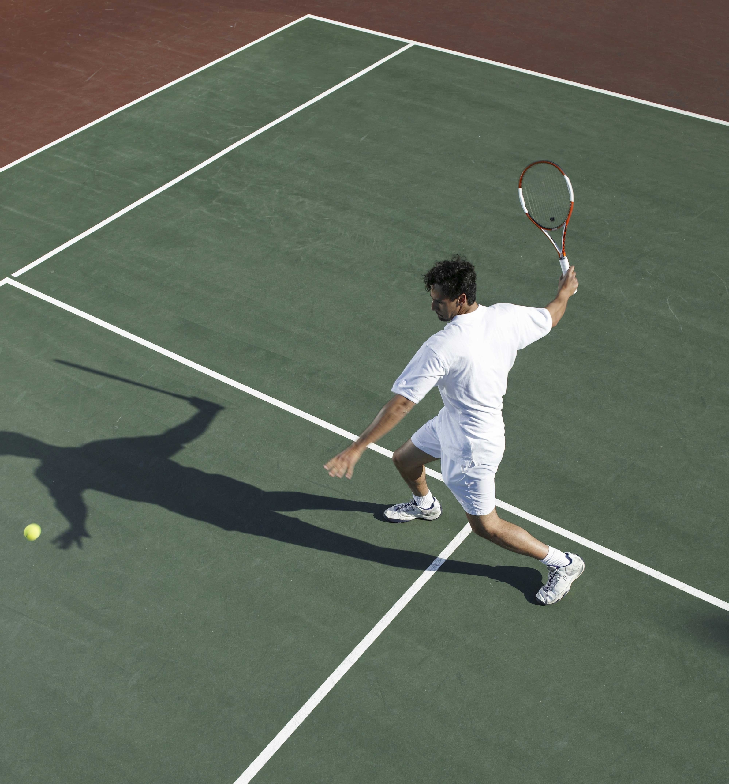 A man playing tennis at a wellness resort