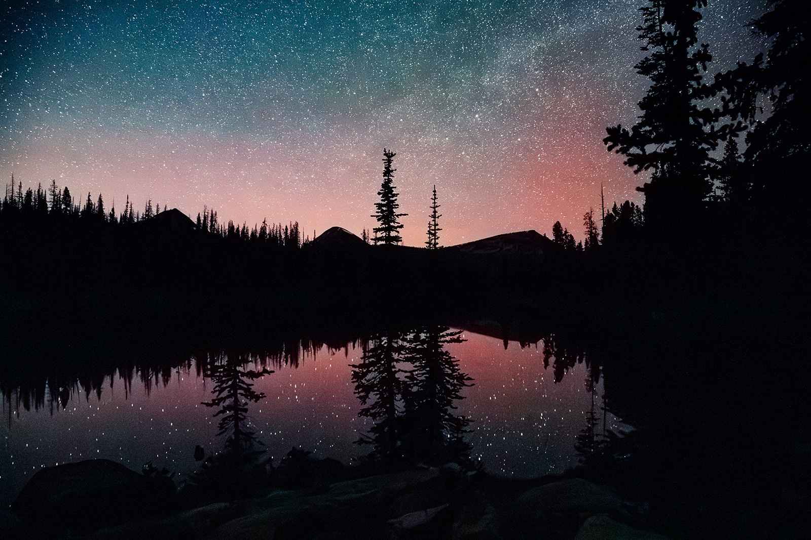 The night sky over a lake in the mountains at Deer Valley