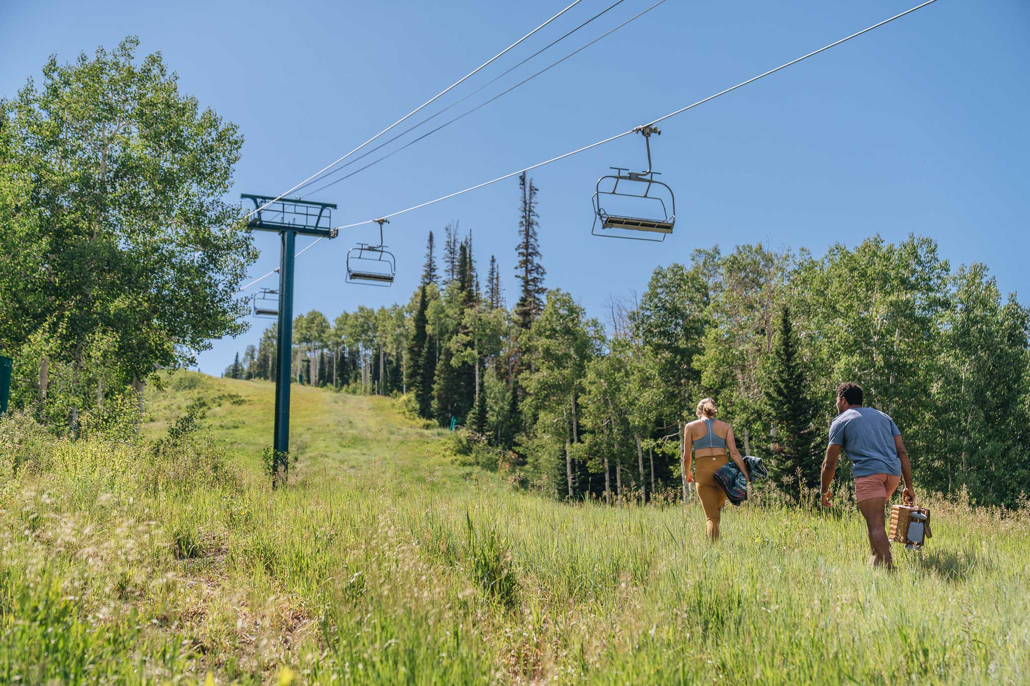 A couple hiking at Deer Valley Resort in the summer