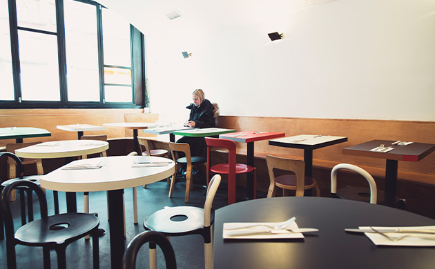 A person eating at Dimes in NYC