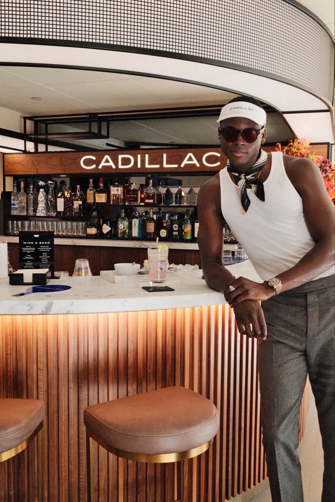 Roza Traore standing by a bar