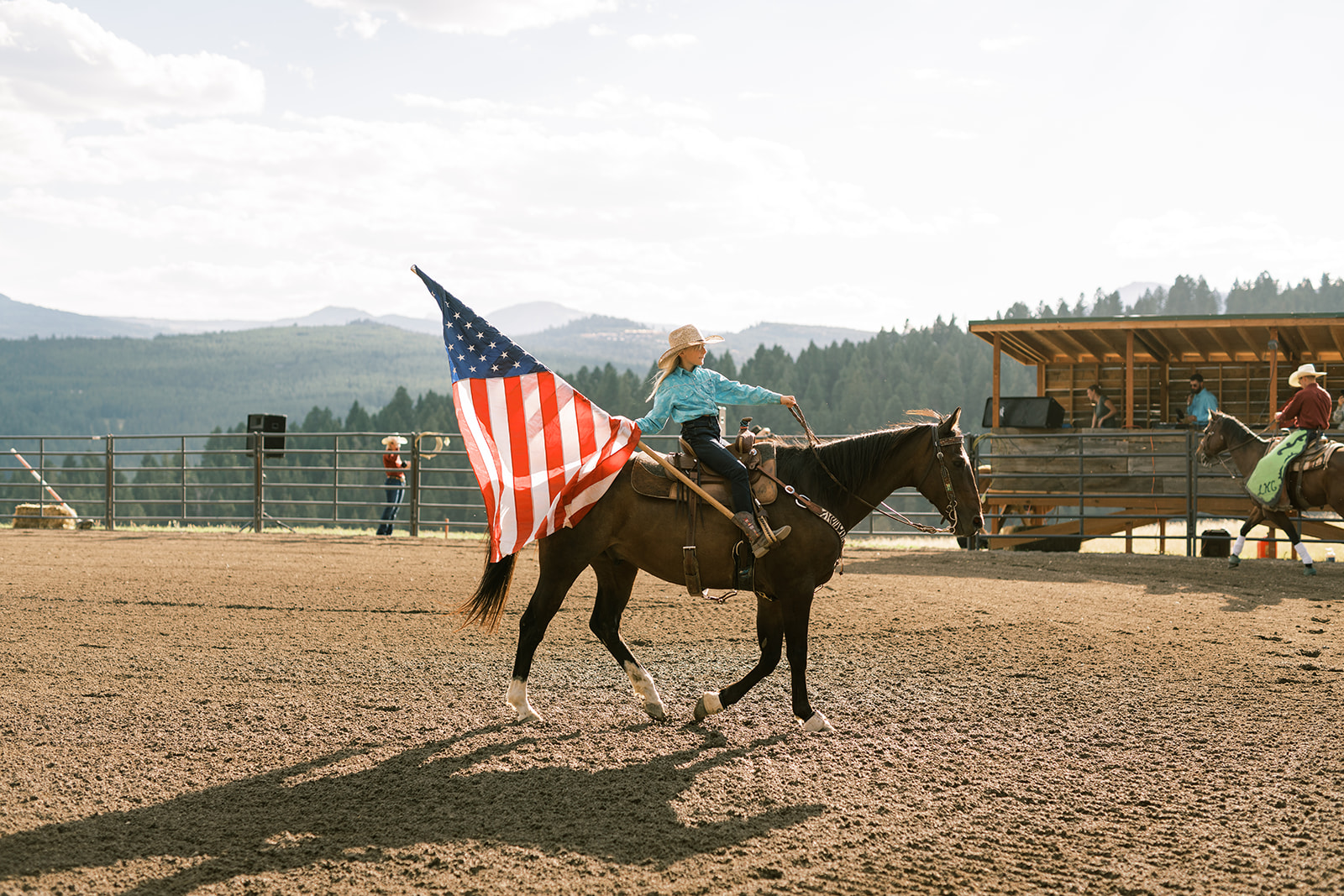 A woman riding a horse during a rodeo in Big Sky