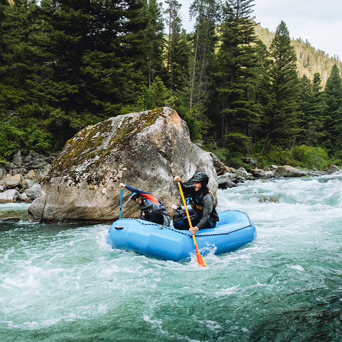 Two people white water rafting in Big Sky