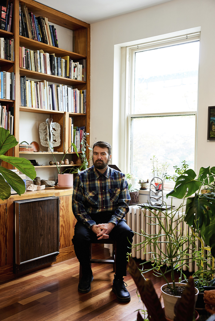 A man sitting in a Baltimore art studio