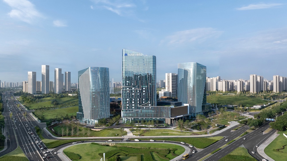 Hotel Nikko Chengdu Yixin Lake rises amid modern towers, its glass exterior gleaming against a blue sky.









Ask ChatGPT