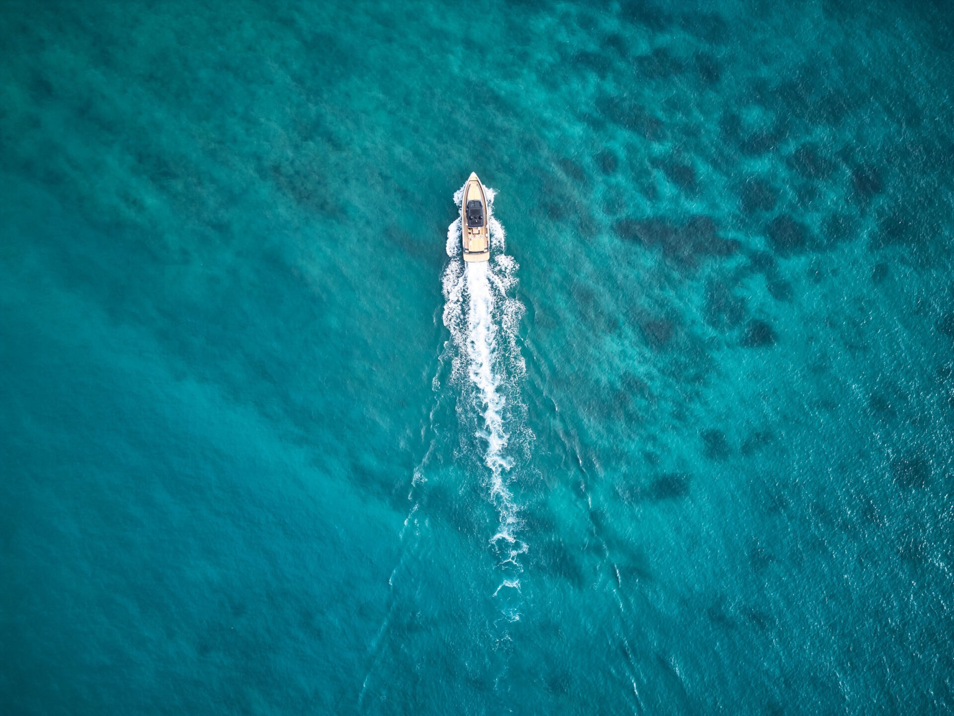 Boat in bright blue waters
