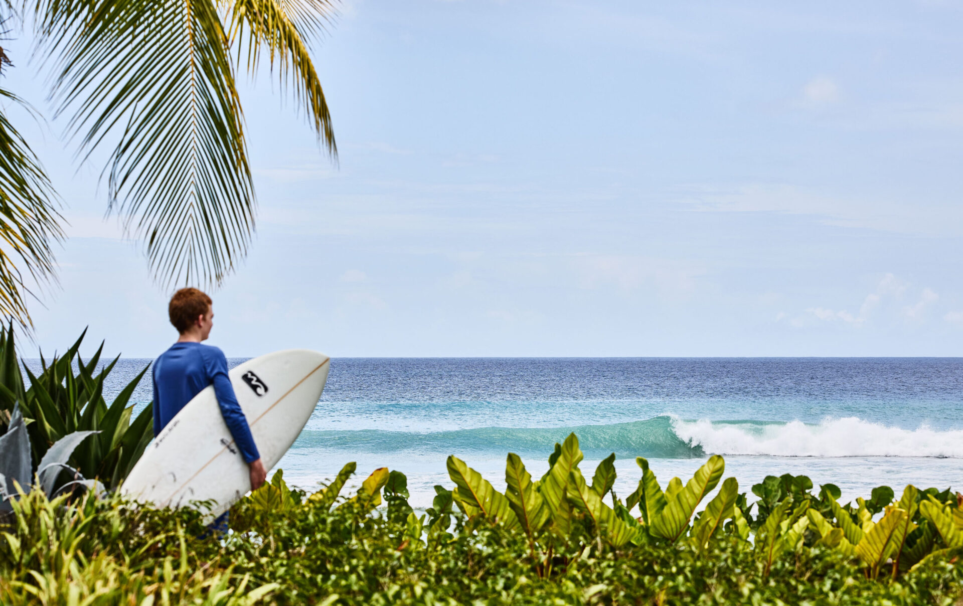 Man holding a surfboard in Barbados
