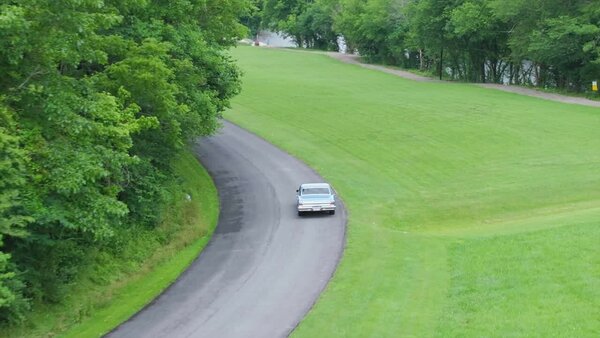 Aerials of Classic Car on Road Clip 2 vfx asset stock footage