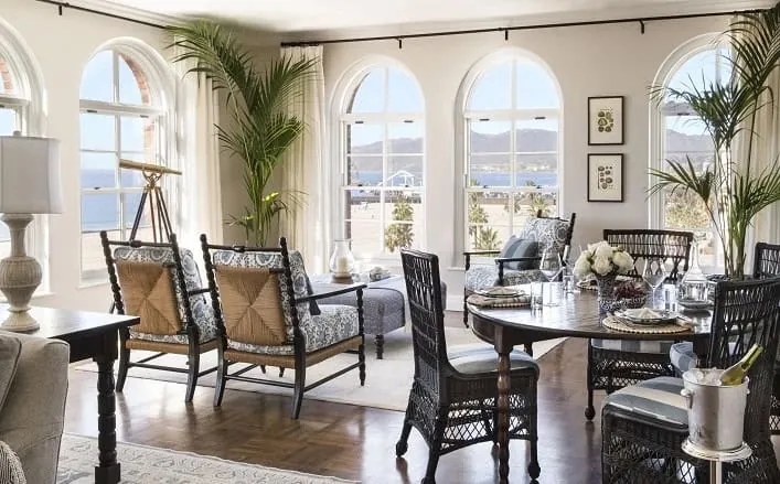 penthouse seating area with windows looking out at the beach