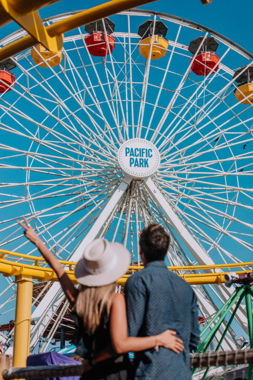 Couple watching the Pacific Park ferris wheel.