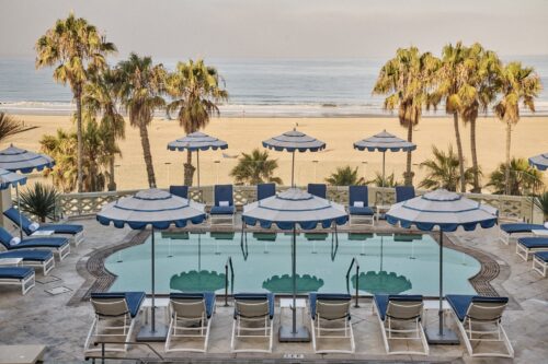 Casa del Mar pool and beach view with palm trees