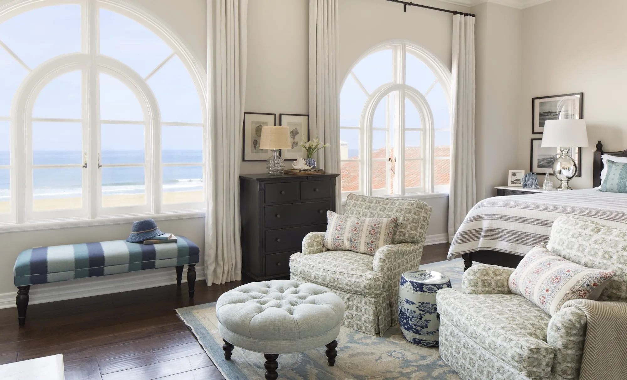 Elegant Penthouse in Santa Monica with arched windows offering beach views.
