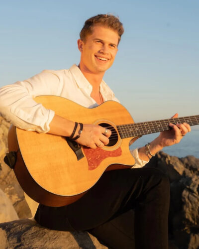 Danny Vee playing the Guitar