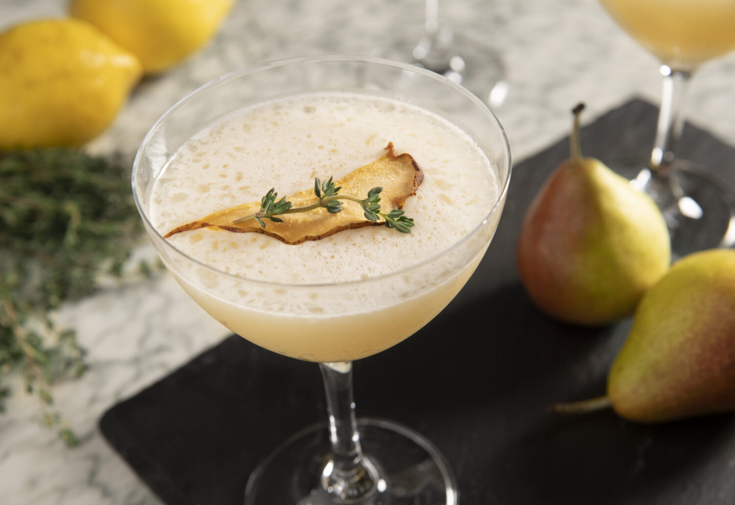 Perfect pear cocktail with garnishes on top