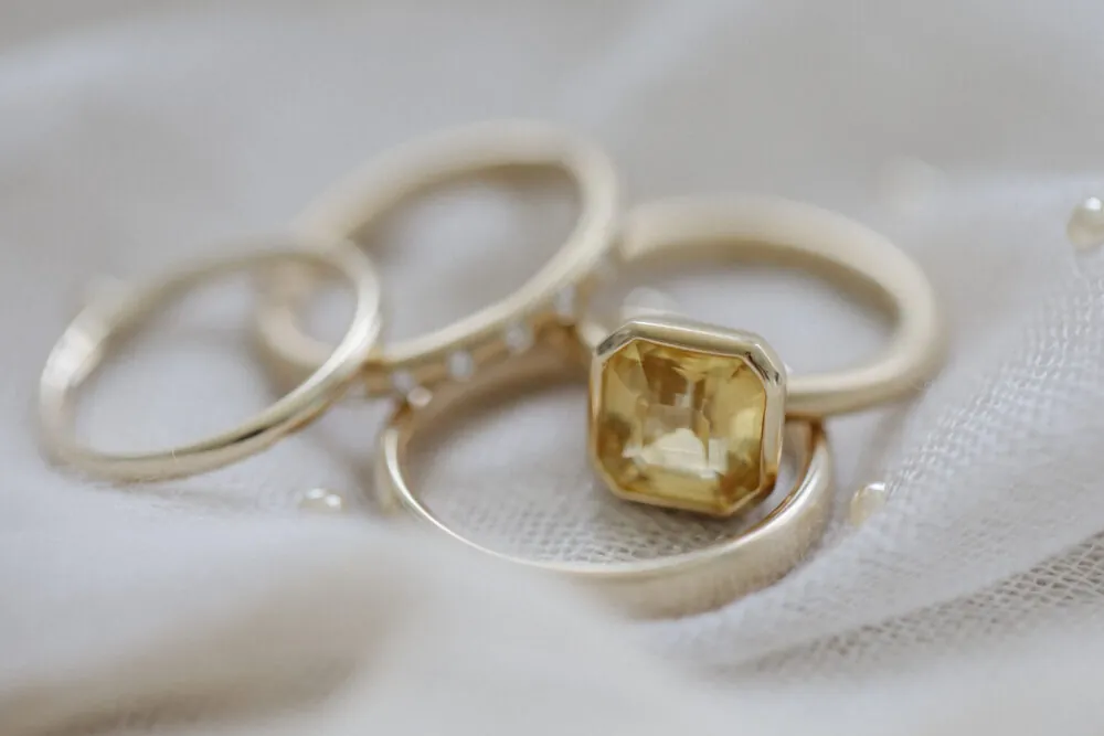up close shot of bride and groom gold wedding bands