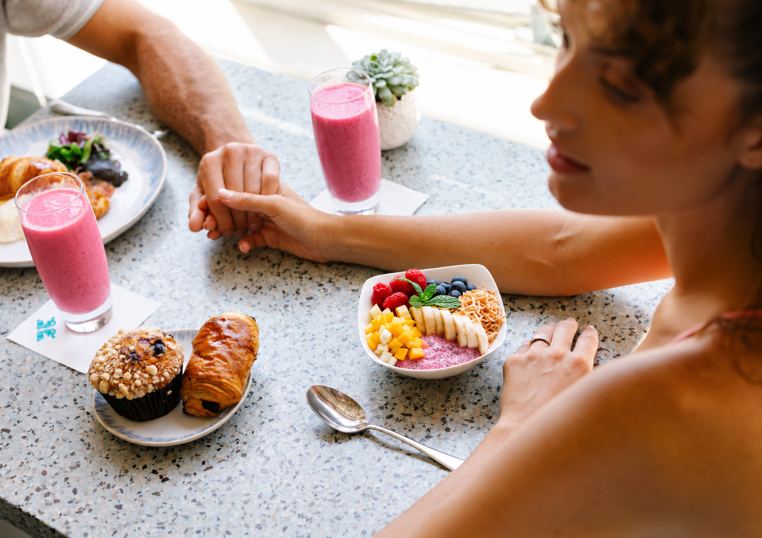 Couple enjoying perfectly pink breakfast at Terrazza