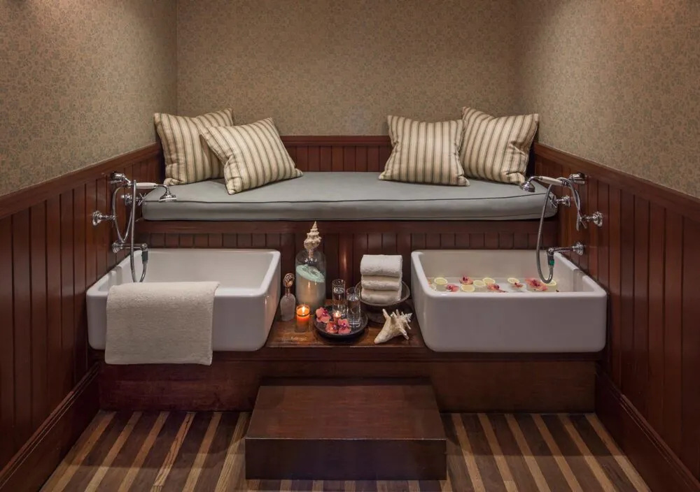 Cozy spa foot soak with warm ambiance and plush seating.