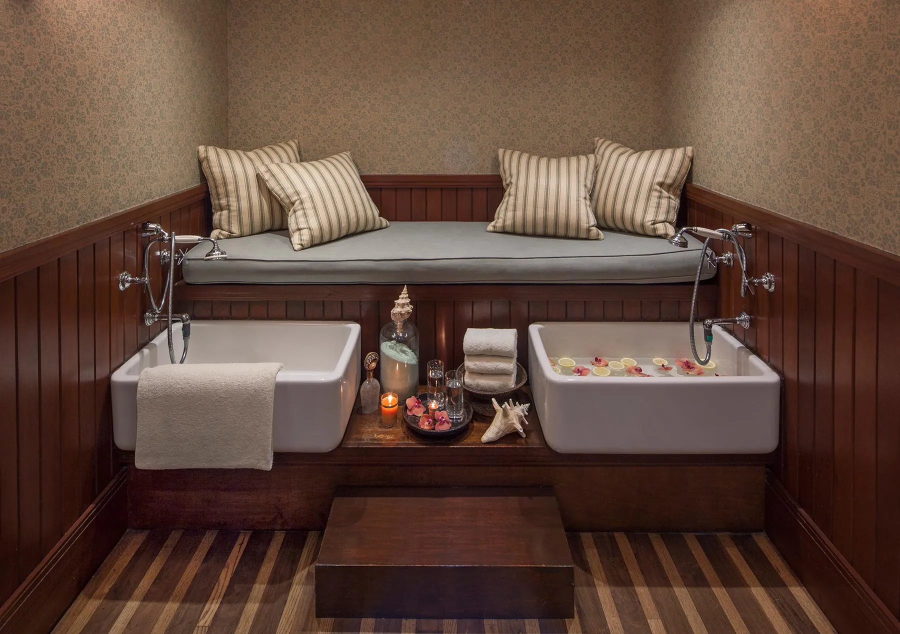 Cozy spa foot soak with warm ambiance and plush seating.