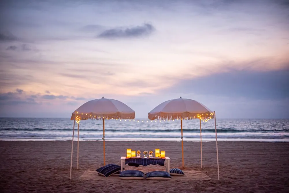 nighttime beach picnic looking at the sunset ocean